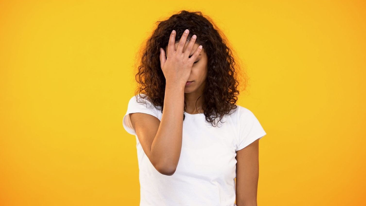 woman with palm to her face